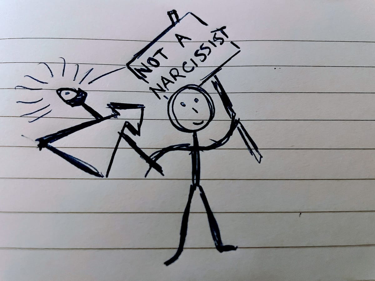 A stick man holding a sign reading 'Not a Narcissist'